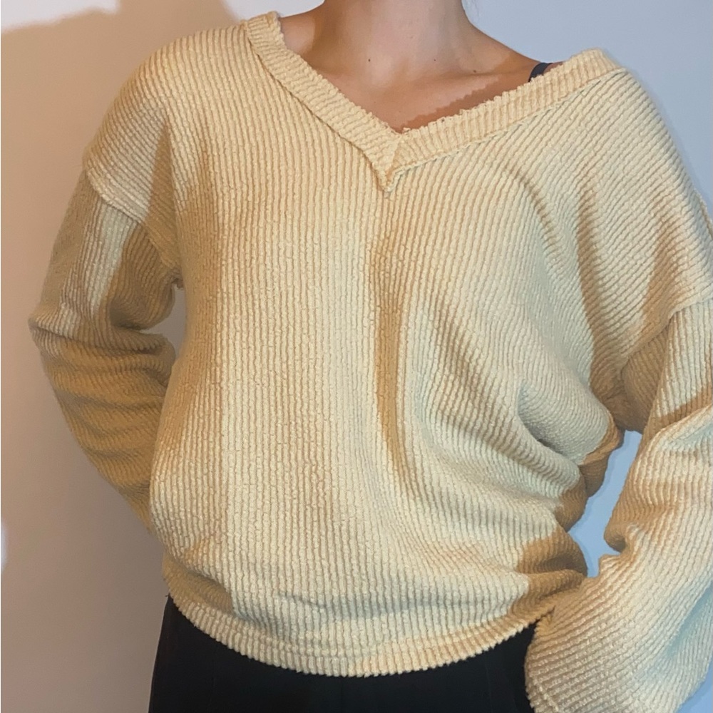 Cream colored V-neck sweater, size medium